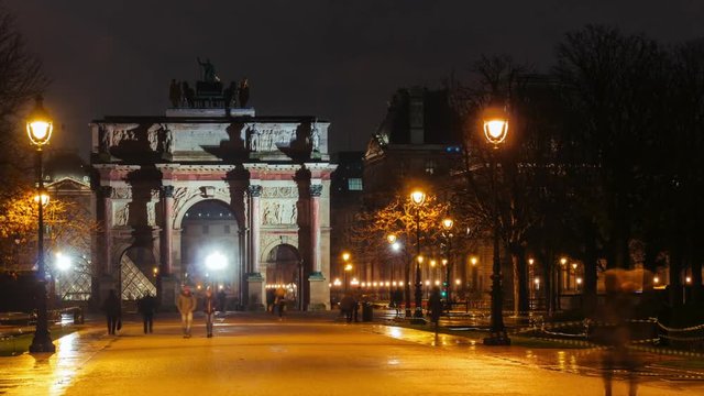 Time lapse zooming of Arc de Triomphe du Carrousel, symbol of Napoleon victories, and Tuileries garden by night. Famous Paris landmarks and popular travel destinations. Tourism and vacations concept