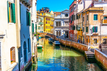 Overlooking bridge in Venetian Canal in Venice, Italy