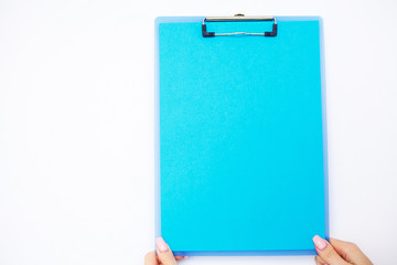Blank Folder with Blue Paper. Hand that Holding Folder and Pen on White Background. Copyspace. Place for Text