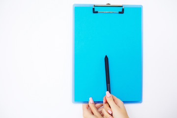 Blank Folder with Blue Paper. Hand that Holding Folder and Pen on White Background. Copyspace. Place for Text