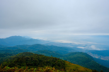 Obraz premium high mountains peaks range clouds in fog scenery landscape national park view outdoor at Chiang Rai, Chiang Mai Province, Thailand