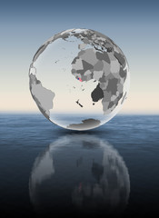 Liberia on translucent globe above water