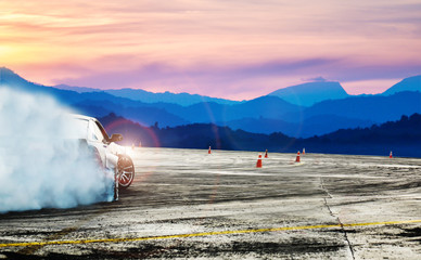 Dramatic car drifting, Blurred of image diffusion race drift car with lots of smoke from burning...