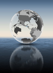 Guatemala on translucent globe above water