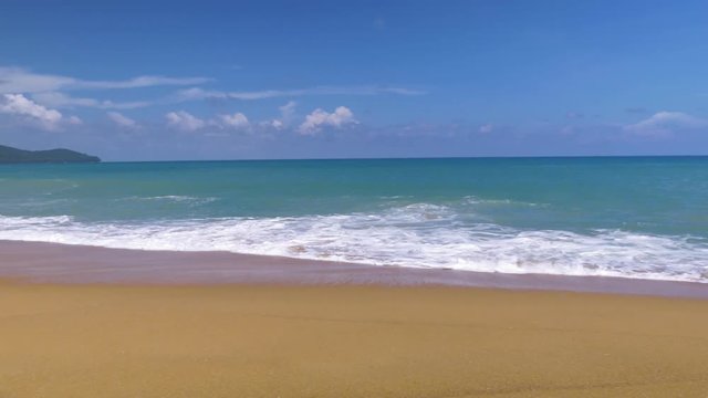 Beautiful blue ocean on sandy beach background with motion scene at Phuket, Thailand
