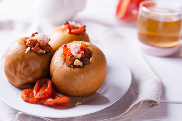 Home healthy healthy breakfast - tea, dried fruits, baked apples with honey. Cozy homemade tea