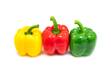 fresh colorful bell peppers isolated on white background
