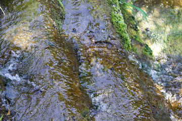 masonry creek in a town with grass