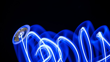 Light painting by a computer on-off switch. Abstract artistic drawing on a black background....