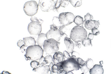 Salt crystals under microscope, light micrograph, close-up view