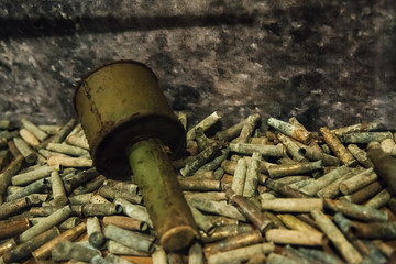 old Soviet hand grenade on artillery shells