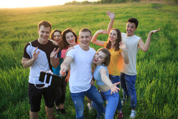 group of joyful youth on the field