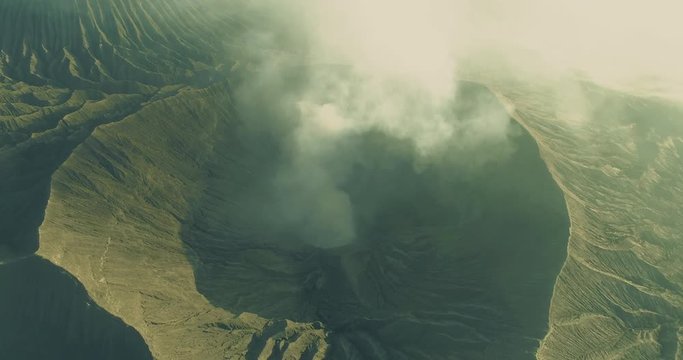 Mount Bromo volcanic crater smoke emission an aerial view, Indonesia