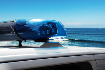 police car on the beach