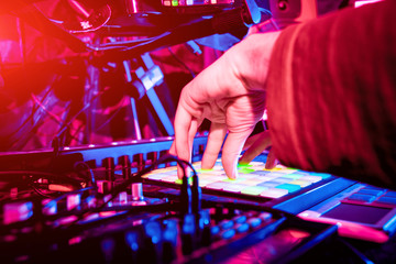 Sound engineer working at mixing panel in the in sound recording studio.