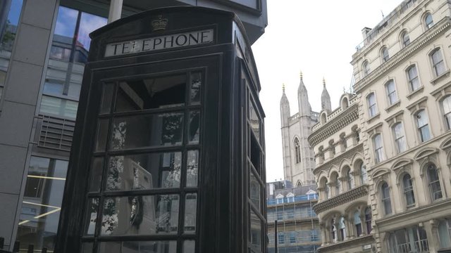 A Black telephone booth. London.