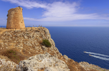 Fototapeta na wymiar Salento coastline: Minervino watchtower. This medieval ruin is located in The Otranto Santa Maria di Leuca Coast and Tricase Woods Regional Nature Park. Italy (Apulia).