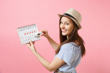 Back rear view woman in dress hold in hand thermometer, female periods calendar, checking menstruation days isolated on pink background. Medical healthcare, ovulation gynecological concept. Copy space