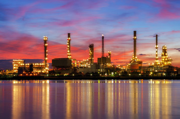 industry zone Oil and gas industrial,Oil refinery plant form industry, petrochemical plant tower, gas flare, smoke stacks and machinery with sunrise and wonderful sky background,Bangkok Thailand