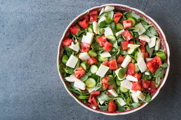 Purslane Salad with Goat Cheese, Cucumber and Tomatoes.
