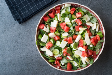 Purslane Salad with Goat Cheese, Cucumber and Tomatoes.
