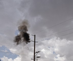 Smoke from a lightning strike on a power pole