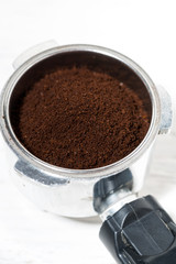 holder with ground coffee for coffee machine, vertical closeup