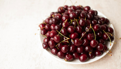 Cherries. Cherry. Cherries in color bowl and kitchen napkin. Red cherry. Fresh cherries. Cherry on white background. healthy food concept