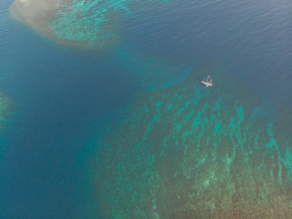 Boat and Dinghy On Caribbean Coral Reef