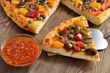 Vegetarian pizza with mushrooms, paprika and green peas