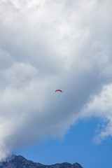 paraglider in the blue clouds 