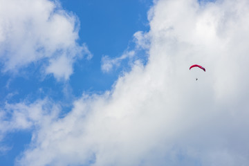 paraglider in the blue clouds 
