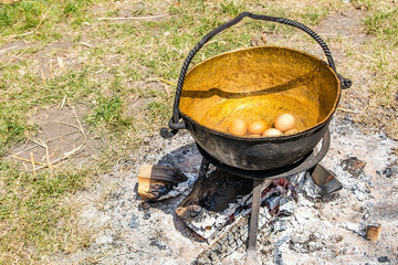 Eggs in old metallic cauldron