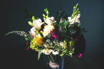 Image of bridal bouquet with garden roses, carnations, freesias and greenery
