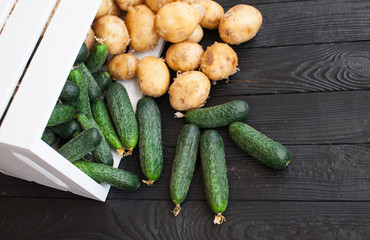 Fresh vegetables in wooden box. Cucumber in the market.