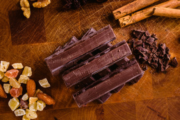 Plate of black chocolate chips with cinnamon and hazelnuts