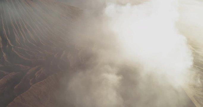 Mount Bromo volcanic crater smoke emission an aerial view, Indonesia