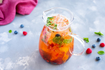 White wine sangria with berries and mint.