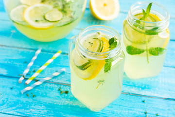 Refreshing lemon drink with citruses and herbs