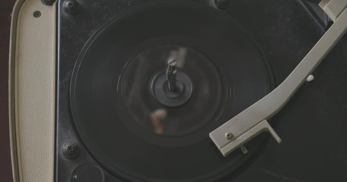 Playing Old Vinyl Record on Vintage Turntable Player