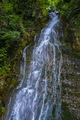 Naklejka premium Alpine landscape with the image of waterfall