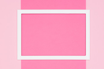 Abstract flat lay pastel pink colored paper texture minimalism background. Minimal template with empty picture frame mock up.