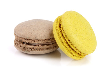 yellow and chocolate macaroon isolated on white background closeup