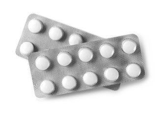 Tablets in strip isolated on white, top view