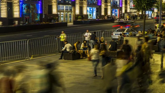 Football fans and spectators have fun on the streets after the game, in Saturday night, time lapse
