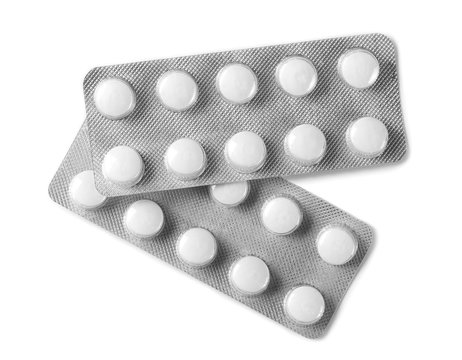 Tablets in strip isolated on white, top view