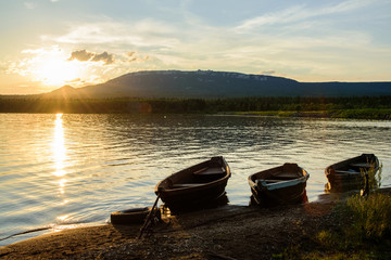 Boats on the lake at sunset