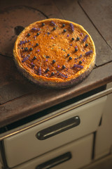 blueberries and lavander cheesecake served on oven with berries and flowers, still life for patisserie, healthy cake