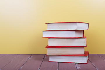 Science and education -  group of colorfull books on the wooden table