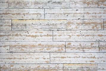 The structure of the wall of stone blocks under marble